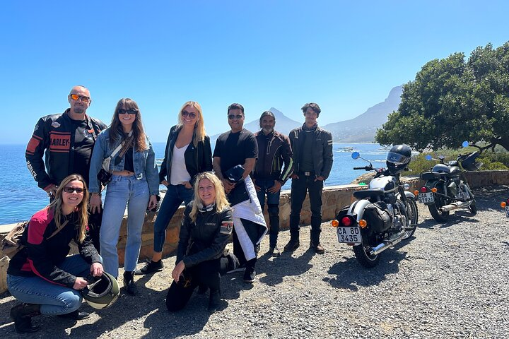 Experience the joy of riding a Classic Royal Enfield along Cape Town's stunning coastline connecting with fellow adventurers and soaking in breathtaking views of iconic landmarks.